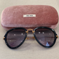 Lente de Sol MIU MIU SMU03Q