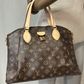 Cartera Louis Vuitton Rivoli MM